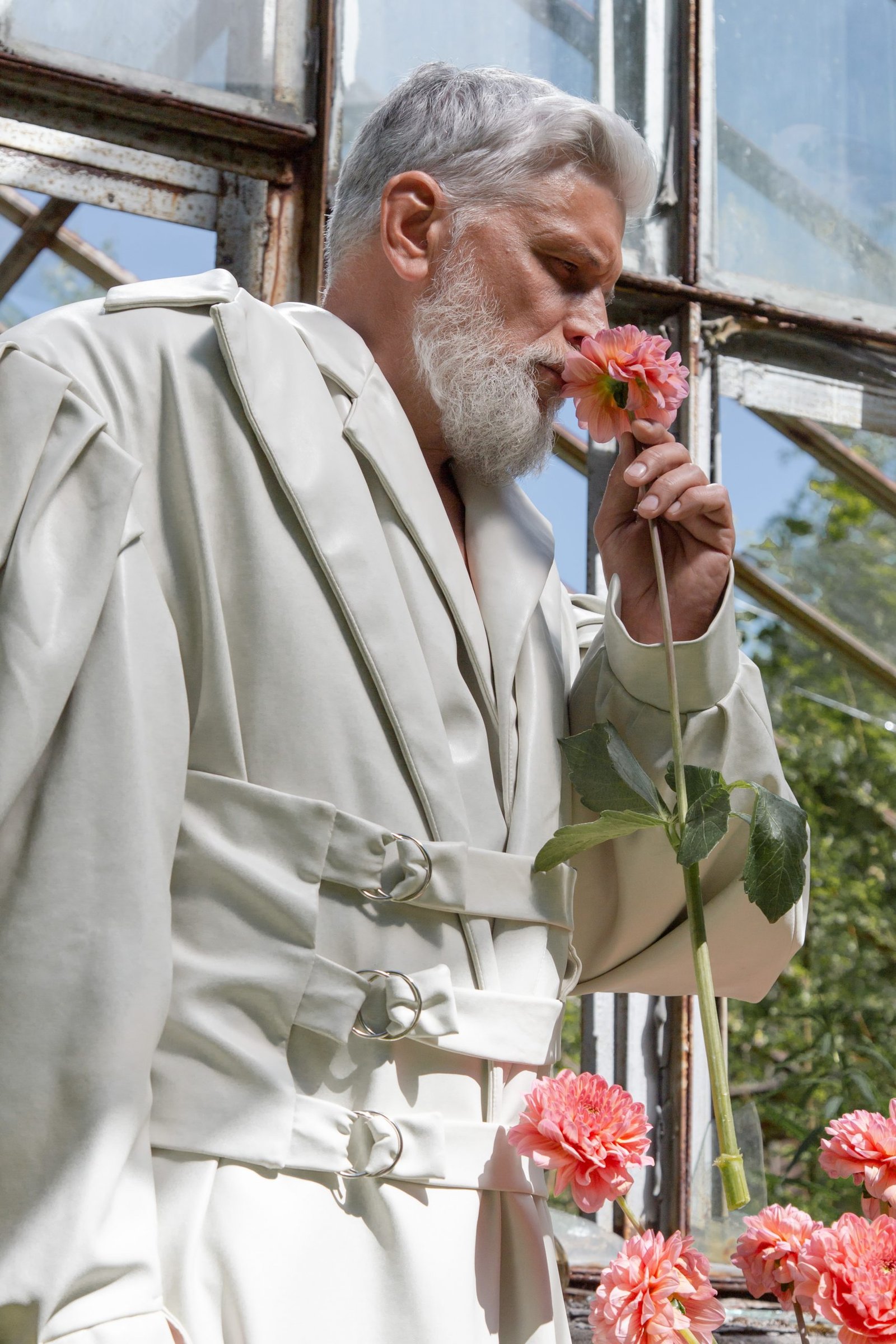 a man smelling a flower stockpack pexels scaled
