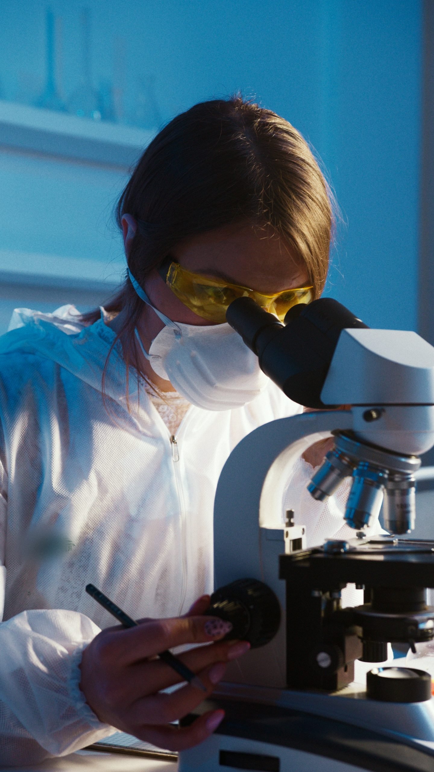 photo of woman looking through microscope stockpack pexels scaled