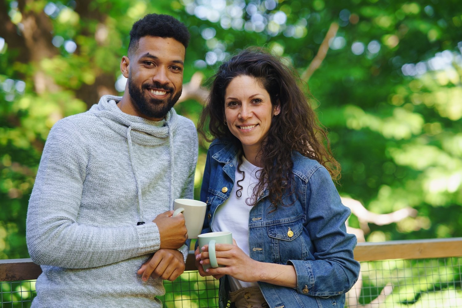 couple resting and looking at camera outdoors in a utc